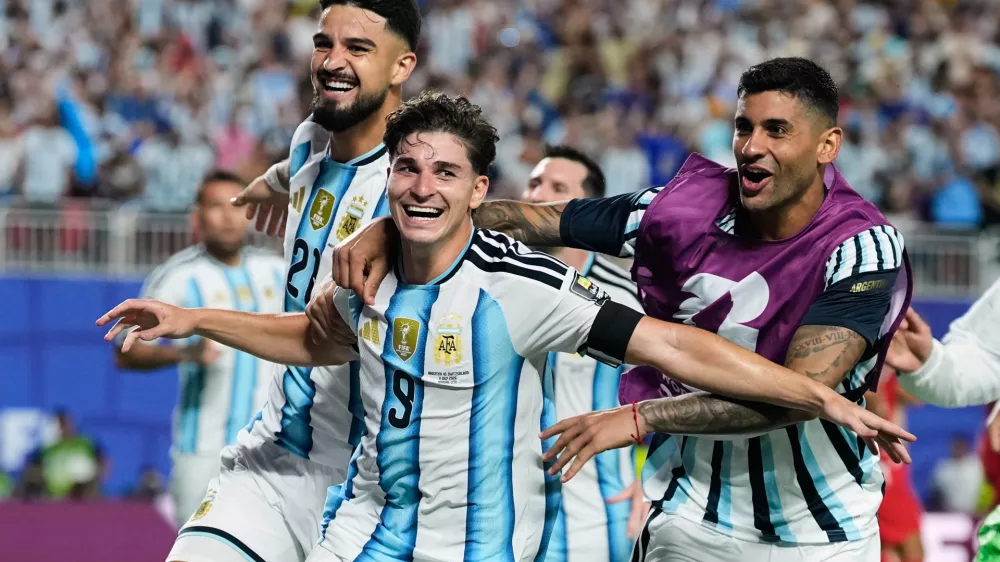 Argentina's Julian Alvarez (9) celebrates after scoring his side's second goal during the World Cup quarterfinal soccer match against Switzerland in Kansas City, Mo., Saturday, July 11, 2026. (AP Photo/Charlie Riedel)