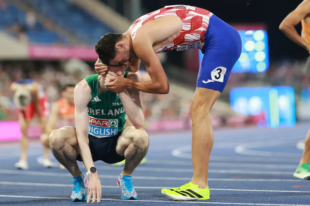 Gold medalist Mark English of Ireland, left, and Marino Bloudek of Croatia congratulate each other after the men's 800 meters final at the European Athletics Championships in Birmingham, England, Thursday, Aug. 13, 2026. (AP Photo/Morgan Harlow)