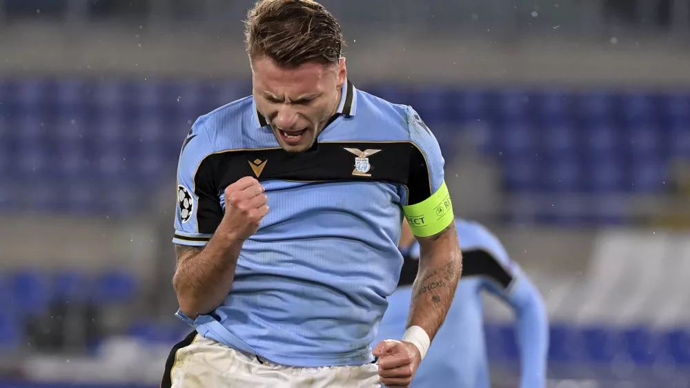 Lazio's Ciro Immobile celebrates after scoring his side's 2nd goal, during the Champions League, group F soccer match between Lazio and Club Brugge, at the Rome Olympic Stadium, Tuesday, Dec. 8, 2020. (Alfredo Falcone/LaPresse via AP)