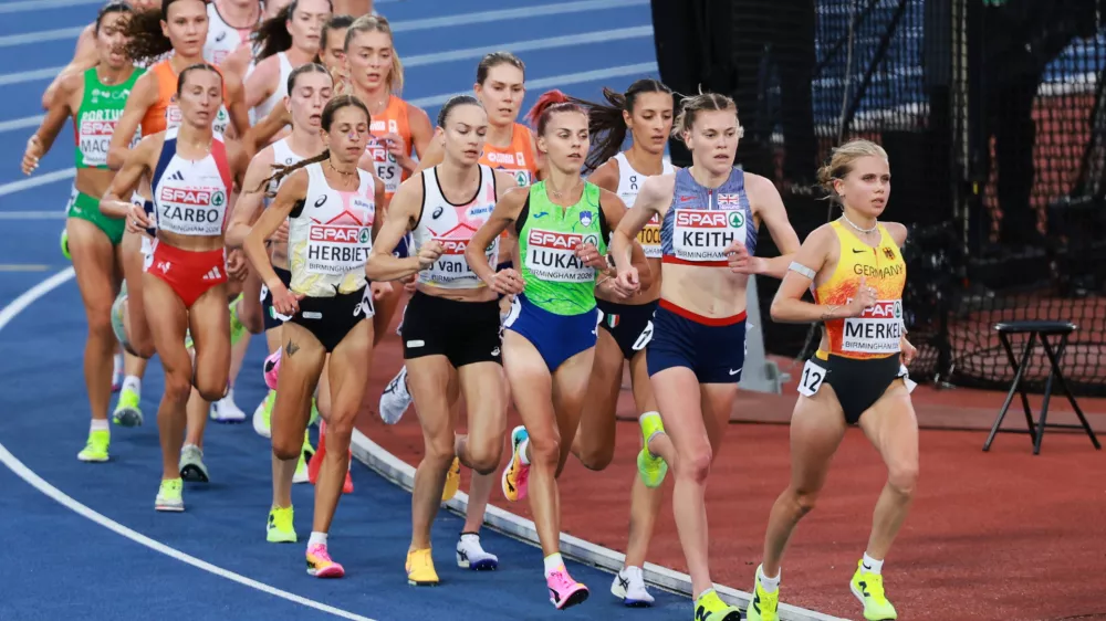 Lisa Merkel of Germany, Megan Keith of Britain, Klara Lukan of Slovenia and Nadia Battocletti of Italy lead the women's 10,000 meters final at the European Athletics Championships in Birmingham, England, Friday, Aug. 14, 2026. (AP Photo/Morgan Harlow)