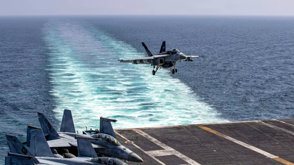 This image provided by U.S. Central Command shows a F/A-18E Super Hornet preparing to make an arrested landing on the USS Abraham Lincoln (CVN 72) after a mission in support of Operation Epic Fury, on Saturday, Feb. 28, 2026. (U.S. Navy via AP)