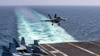 This image provided by U.S. Central Command shows a F/A-18E Super Hornet preparing to make an arrested landing on the USS Abraham Lincoln (CVN 72) after a mission in support of Operation Epic Fury, on Saturday, Feb. 28, 2026. (U.S. Navy via AP)