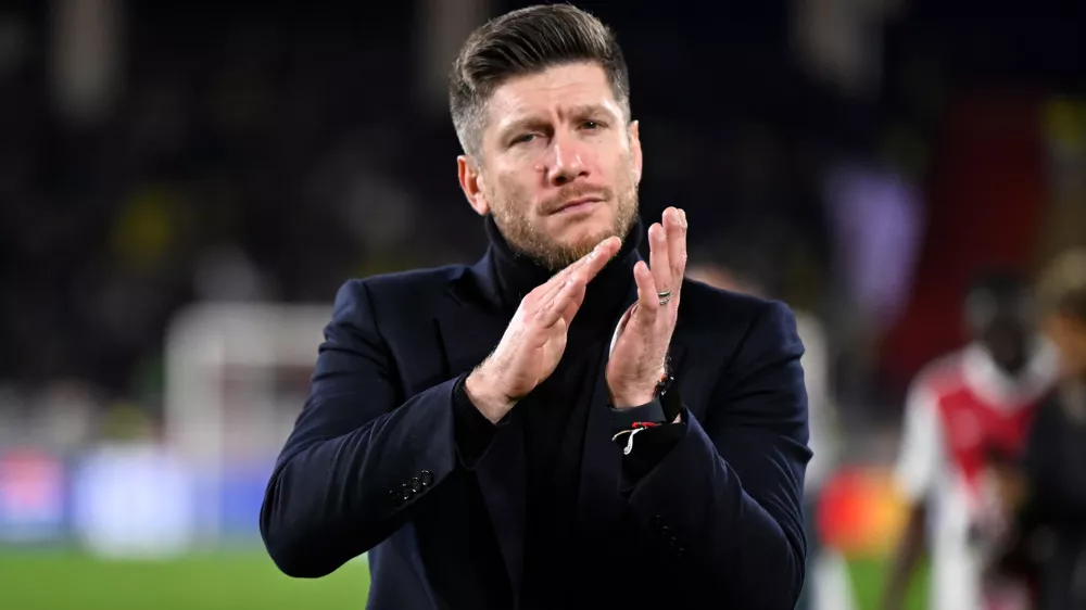 FILE - Monaco's then head coach Sebastien Pocognoli applauds after the Champions League opening phase soccer match between Monaco and Juventus in Monaco, Wednesday, Jan. 28, 2026. (AP Photo/Philippe Magoni, File)