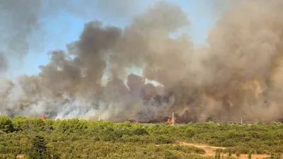 Smoke and flames rise from a wildfire in Zadar, Croatia, August 14, 2026, in this screen grab obtained from a social media video. DOMINIK BRKLJACA/via REUTERS THIS IMAGE HAS BEEN SUPPLIED BY A THIRD PARTY. MANDATORY CREDIT. NO RESALES. NO ARCHIVES. Verification: -Buildings, terrain and roads that matched the archive and satellite imagery of the area. -Coordinates: 44.162936, 15.227675. -Original file metadata. -Croatian Fire Service reports of the fire.
