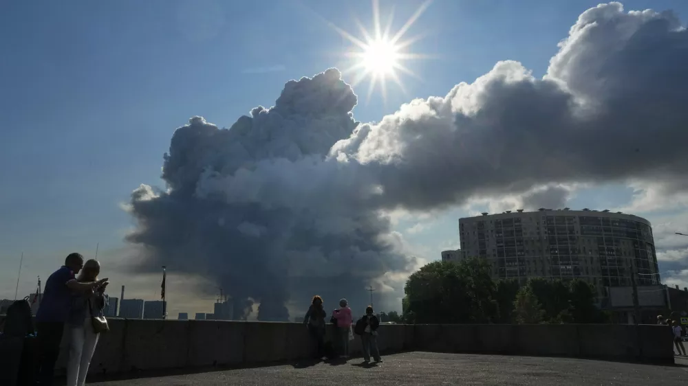 FILE - Smoke rises following a Ukrainian drone strike on a warehouse belonging to online retailer Wildberries, in St. Petersburg, Russia, on Friday, July 24, 2026. (UGC via AP, File)