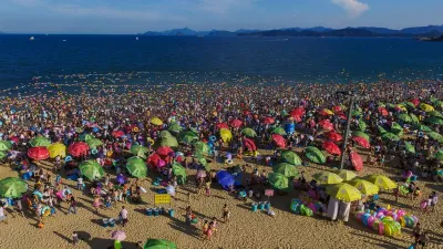 SHENZHEN, Aug. 2, 2015 People enjoy themselves at the Dameisha Beach Seashore Park in Shenzhen, south China's Guangdong Province, Aug. 2, 2015. As temperature rises in summer in Shenzhen, many tourists went to the seaside for swimming and sunbath.,Image: 254463175, License: Rights-managed, Restrictions:, Model Release: no 