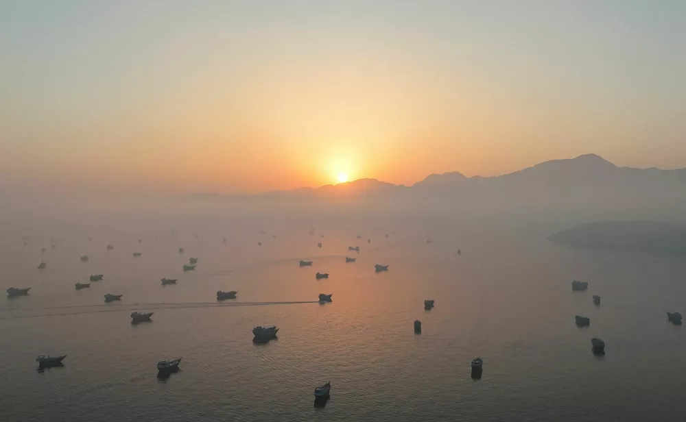 FILE PHOTO: A drone view shows vessels in the Strait of Hormuz, as seen from Musandam, Oman, June 15, 2026. REUTERS/Stringer/File Photo