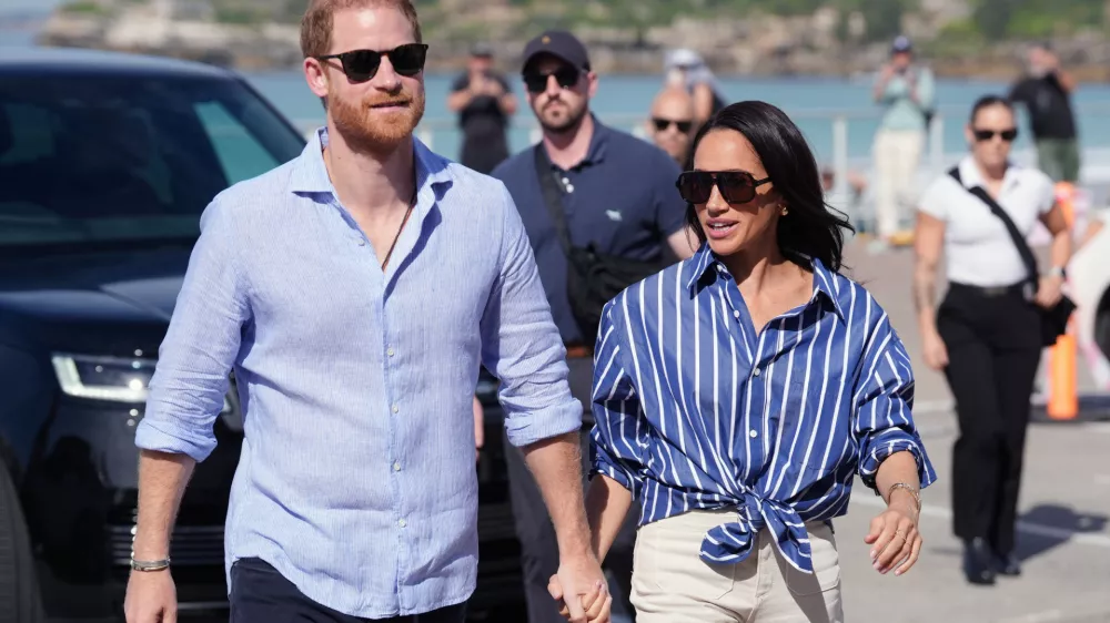 FILE - Prince Harry, and Meghan, the Duke and Duchess of Sussex, arrive for an event, during a visit to Bondi Beach, Australia, April 17, 2026. (Jonathan Brady/Pool Photo via AP, File)