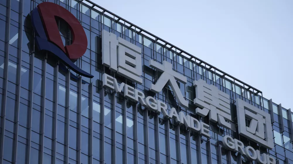 FILE - The Evergrande Group headquarters logo is seen in Shenzhen in southern China's Guangdong province on Sept. 24, 2021. A top executive of China Evergrande's electric vehicle company has been detained by police in the latest sign of trouble for the world's most heavily indebted property developer. (AP Photo/Ng Han Guan, File)
