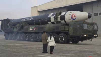 This photo provided on Nov. 19, 2022, by the North Korean government shows North Korean leader Kim Jong Un, left, and his daughter inspect what it says a Hwasong-17 intercontinental ballistic missile at Pyongyang International Airport in Pyongyang, North Korea, Friday, Nov. 18, 2022. Independent journalists were not given access to cover the event depicted in this image distributed by the North Korean government. The content of this image is as provided and cannot be independently verified. Korean language watermark on image as provided by source reads: "KCNA" which is the abbreviation for Korean Central News Agency. (Korean Central News Agency/Korea News Service via AP)