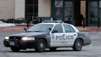 FILE - An Omaha police car drives on Dec. 8, 2007, in Omaha, Neb. (AP Photo/Jeff Roberson, File)
