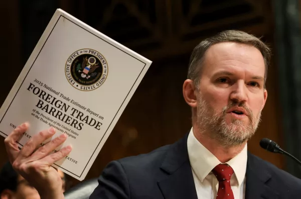 U.S. Trade Representative Jamieson Greer holds a copy of "Foreign Trade Barriers" as he testifies before a Senate Finance Committee hearing on U.S. President Donald Trump's trade policy, on Capitol Hill in Washington, D.C., U.S., April 8, 2025. REUTERS/Kevin Mohatt