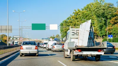 Car carrying trailer in the asphalt road of Slovenia.
