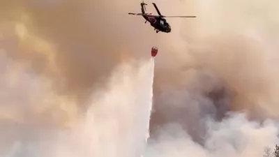 A Nevada National Guard helicopter drops water on the Hawk Fire, as the wildfire burns, in Reno, Nevada, U.S., August 23, 2026, in this still image taken from video.  Nevada National Guard/Handout via REUTERS  THIS IMAGE HAS BEEN SUPPLIED BY A THIRD PARTY. NO RESALES. NO ARCHIVES. MANDATORY CREDIT