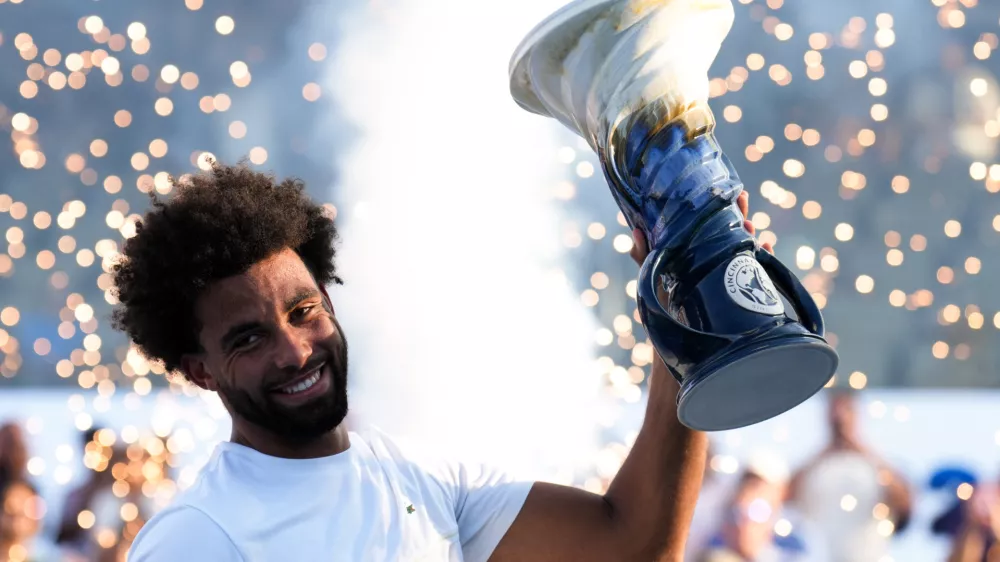 Aug 23, 2026; Cincinnati, OH, USA; Arthur Fils (FRA) celebrates with the Rookwood Cup after defeating Frances Tiafoe (USA) during the finals of the Cincinnati Open at Lindner Family Tennis Center. Mandatory Credit: Aaron Doster-Imagn Images