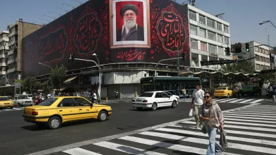 People walk past a billboard with an image of Iran's late Supreme Leader Ayatollah Ali Khamenei in Tehran, Iran, July 13, 2026. Majid Asgaripour/WANA (West Asia News Agency) via REUTERS ATTENTION EDITORS - THIS PICTURE WAS PROVIDED BY A THIRD PARTY. ISRAEL OUT. NO COMMERCIAL OR EDITORIAL SALES IN ISRAEL. NO ACCESS FOR ISRAELI MEDIA. NO USE BBC PERSIAN. NO USE VOA PERSIAN. NO USE MANOTO. NO USE IRAN INTERNATIONAL. NO USE RADIO FARDA. DIGITAL: NO USE BBC PERSIAN. NO USE VOA PERSIAN. NO USE MANOTO. NO USE IRAN INTERNATIONAL. NO USE RADIO FARDA.