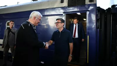Ukraine's Foreign Affairs Minister Andrii Sybiha greets Britain's prime minister Andy Burnham upon his arrival by train in Kyiv on August 24, 2026. Ukraine is marking on August 24 the 35th anniversary of its independence. HENRY NICHOLLS/Pool via REUTERS