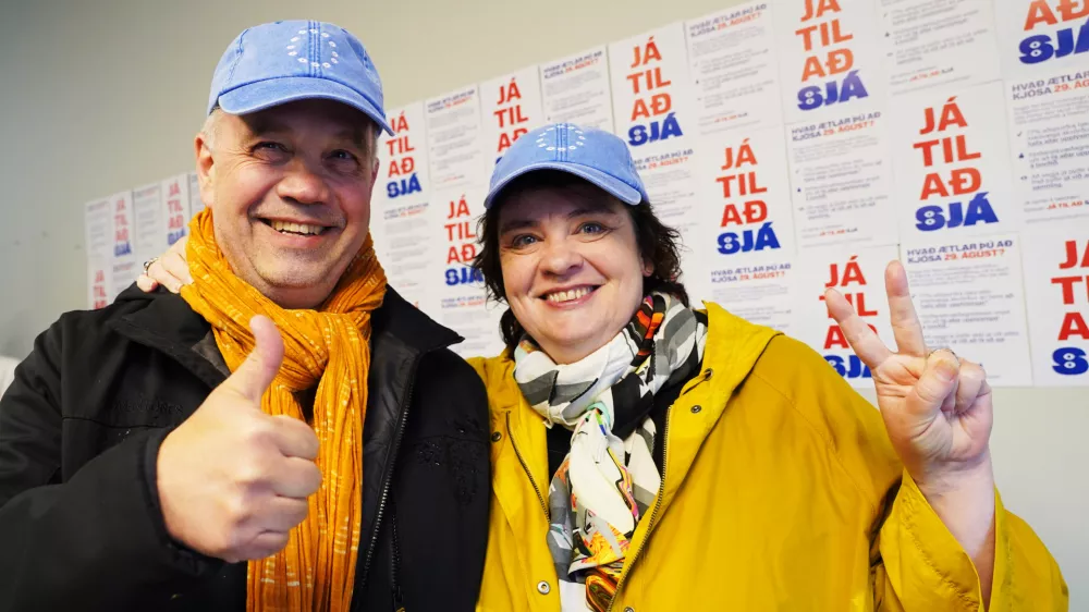 Supporters pose for a photo at the opening of the "Yes" campaign's office in Reykjavik, Iceland, Friday, Aug. 7, 2026. (AP Photo/James Brooks)