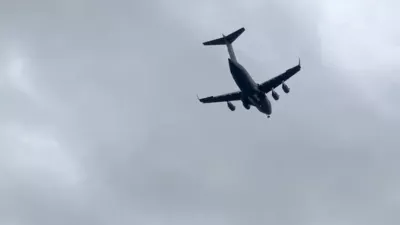 A U.S. military transport plane approaches Moscow, Russia, August 25, 2026, in this screen grab taken from a social media video. Social Media/via REUTERS THIS IMAGE HAS BEEN SUPPLIED BY A THIRD PARTY. NO RESALES. NO ARCHIVES. VERIFICATION: - Buildings, car park and trees matched satellite and archive imagery. - Aircraft verified as a Boeing C-17A Globemaster III from the engines, the wings and the tail, which matched archive imagery of the aircraft. - Flight monitoring data confirms it's a U.S. Air Force Aircraft. - Date verified by flight monitoring data. - Aircraft is flying in the direction of Moscow's Vnukovo airport.