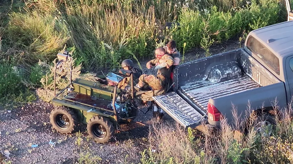  SENSITIVE MATERIAL. THIS IMAGE MAY OFFEND OR DISTURB  Ukrainian commander Vladyslav Polskyi, 29, who earned the nation's highest military honour, the Hero of Ukraine, rescues injured service members from an unmanned ground vehicle (UGV), amid Russia's attack on Ukraine, in Kharkiv region, Ukraine, in this screengrab obtained from a handout video, August 15, 2026. Ukrainian Armed Forces/Handout via REUTERS  THIS IMAGE HAS BEEN SUPPLIED BY A THIRD PARTY