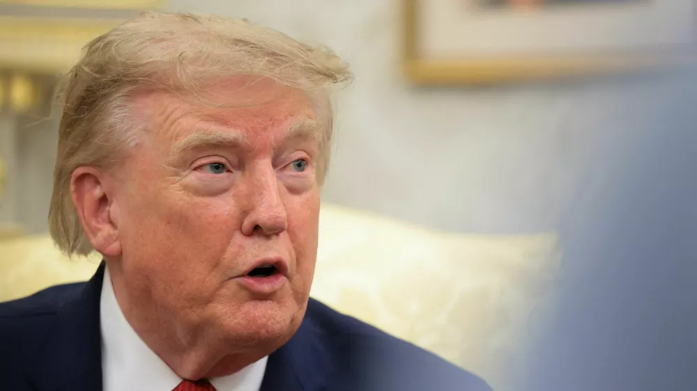 U.S. President Donald Trump speaks as he hosts 16-year-old lifeguard Ryder Williams, who saved a child off the coast of Santa Cruz, California, last month, Nathaniel Rai, the child saved by Williams, and Nathaniel's family members in the Oval Office at the White House in Washington, D.C., U.S., August 17, 2026. REUTERS/Kylie Cooper