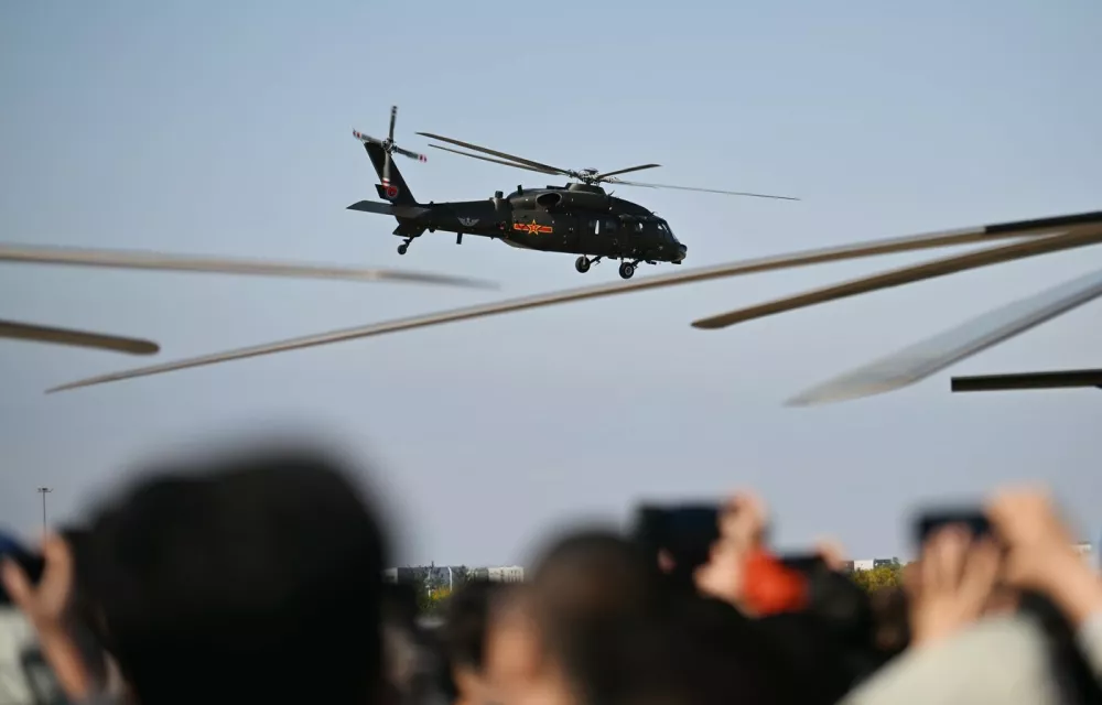 TIANJIN, Oct. 18, 2025 -- A Z-20 helicopter performs during the 7th China Helicopter Exposition in north China's Tianjin Municipality, Oct. 18, 2025. The exposition opened to the general public on Saturday.,Image: 1046398847, License: Rights-managed, Restrictions:, Model Release: no 