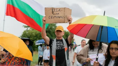 Protesters hold signs, including one opposing the United States, as they gather near Bezmer Air Base near Yambol, Bulgaria, on July 24, 2026, to demonstrate against the deployment of eight US aircraft and 250 personnel. The KC-135 planes are intended for air refueling during US military operations against Iran. Demonstrators have expressed concerns that the air base could become a target for Iran.People Protest Against Deployment Of Eight US Aircraft And 250 Personnel At Bezmer Air Base Near Yambol, Bulgaria, Bezmer Village, Yambol - 24 Jul 2026,Image: 1118392152, License: Rights-managed, Restrictions:, Model Release: no 