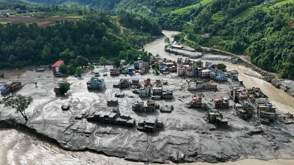 A drone view shows mud covering buildings and property following devastating floods at Trishuli in Nuwakot district, Nepal, August 27, 2026. REUTERS/Navesh Chitrakar