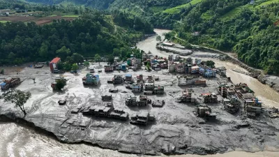 A drone view shows mud covering buildings and property following devastating floods at Trishuli in Nuwakot district, Nepal, August 27, 2026. REUTERS/Navesh Chitrakar