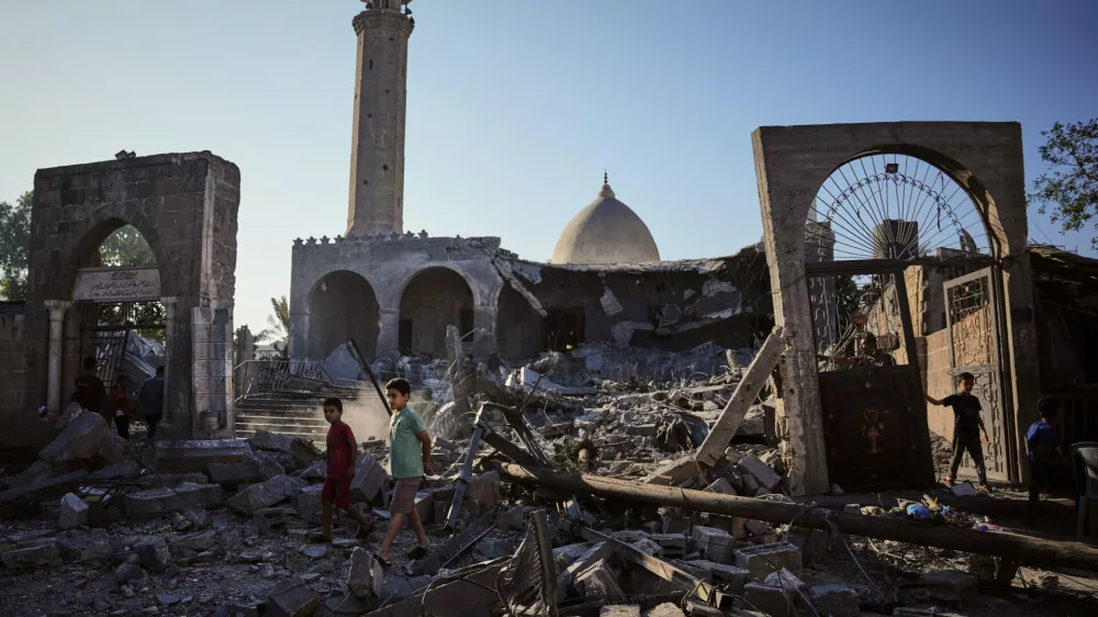 Palestinians inspect the Abu Salim Mosque a day after it was hit by an Israeli airstrike, in Deir al-Balah, central Gaza Strip, Tuesday, Aug. 25, 2026. (AP Photo/Abdel Kareem Hana)