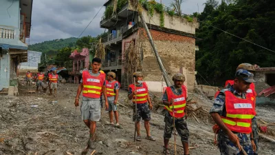 Workers clear debris in the aftermath of a flash flood in the Devighat area of Nuwakot district in Nepal, Friday, Aug. 28, 2026. (AP Photo/Rajesh Kumar Singh)
