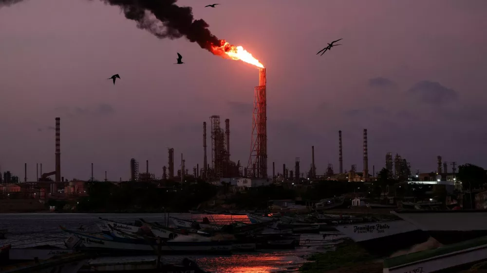 FILE PHOTO: A gas flare burns at the Cardon refinery, part of the Paraguana Refining Center, as years of underinvestment, equipment failures and shortages have hampered fuel production in Venezuela, in Punta Cardon, Venezuela, May 6, 2026. REUTERS/Gaby Oraa/File Photo
