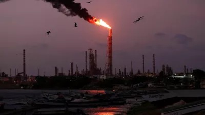 FILE PHOTO: A gas flare burns at the Cardon refinery, part of the Paraguana Refining Center, as years of underinvestment, equipment failures and shortages have hampered fuel production in Venezuela, in Punta Cardon, Venezuela, May 6, 2026. REUTERS/Gaby Oraa/File Photo