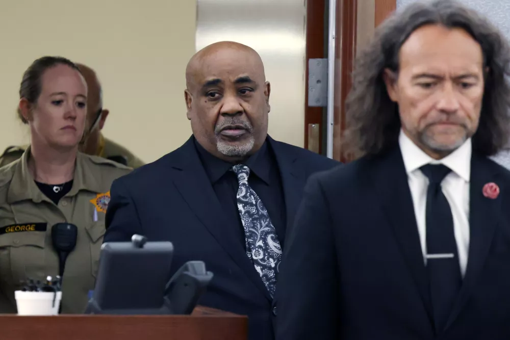Duane Davis, center, and his attorney Michael Sanft are led back to a courtroom to hear his sentencing date after a jury found Davis guilty of first-degree murder in his trial related to the 1996 killing of rapper Tupac Shakur, at Clark County District Court Regional Justice Center, Monday, Aug. 31, 2026, in Las Vegas. (Bizuayehu Tesfaye/Las Vegas Review-Journal via AP, Pool)