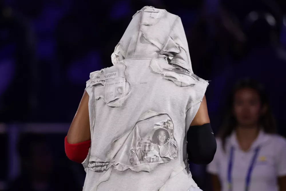 Naomi Osaka, of Japan, arrives to compete against Anastasia Zakharova, of Russia, during the first round of the U.S. Open tennis championships Monday, Aug. 31, 2026, in New York. (AP Photo/Adam Hunger)