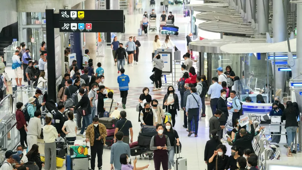 Tourists arrive, ahead of brace of an influx of Chinese tourists as COVID restriction are dismantled, at Bangkok's Suvarnabhumi airport, Thailand, January 4, 2023. REUTERS/Athit Perawongmetha
