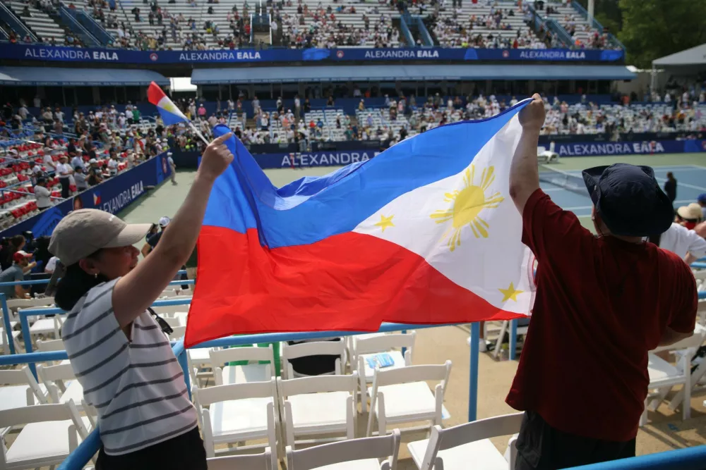 Fans wave the flag of the Philippines and celebrate Alexandra Eala's victory over Zheng Qinwen during the women's singles Round 1 match at the Mubadala DC Open on Tuesday, July 28, 2026,Image: 1120482273, License: Rights-managed, Restrictions: *** World Rights ***, Model Release: no 