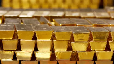 FILE - Gold bars are stacked in a vault at the United States Mint on July 22, 2014, in West Point, N.Y. (AP Photo/Mike Groll, File)