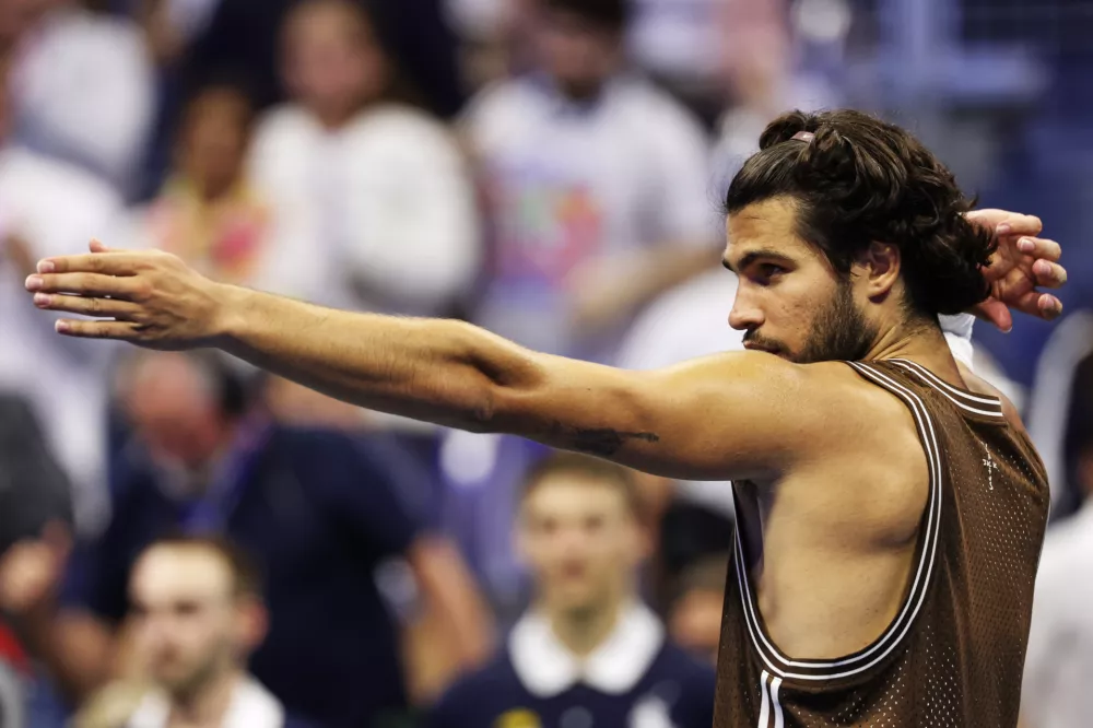 Carlos Alcaraz, of Spain, celebrates winning a match against Jaime Faria, of Portugal, during the second round of the U.S. Open tennis championships, Wednesday, Sept. 2, 2026, in New York. (AP Photo/Adam Hunger)