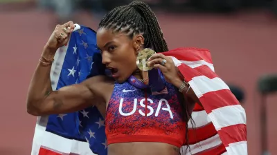 14 September 2025, Japan, Tokyo: USA's Tara Davis-Woodhall poses for a photo with her Gold Medal after winning the Woman's Long Jump Final on Day Two of the World Athletics Championships Tokyo 2025 at National Stadium. Photo: Oliver Weiken/dpa