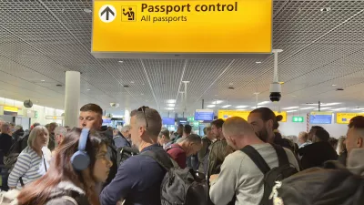 Amsterdam, Netherlands - June 5, 2025: Passengers waiting in a queue to clear Passport Control at Schiphol Airport, Amsterdam.