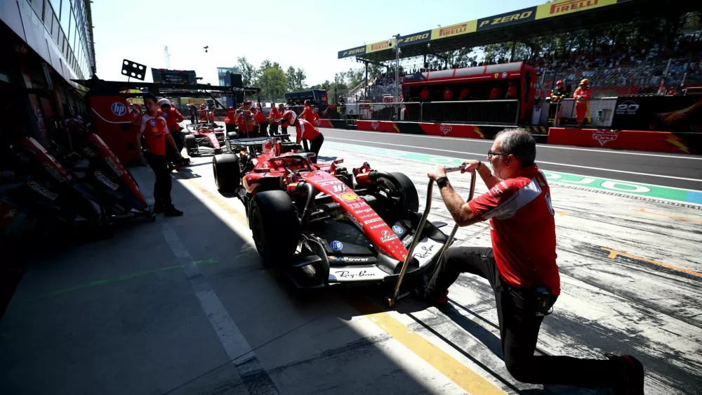 Formula One F1 - Italian Grand Prix - Autodromo Nazionale Monza, Monza, Italy - September 4, 2026 Ferrari's Charles Leclerc and Ferrari's Lewis Hamilton in the pits after practice REUTERS/Guglielmo Mangiapane