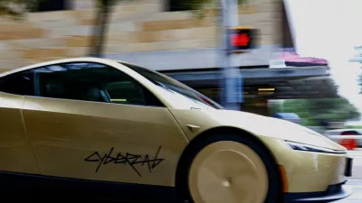 A gold-colored Tesla Cybercab arrives for an event in downtown Austin, Texas, U.S., September 3, 2026. Picture taken with a slow shutter speed. REUTERS/Kaylee Greenlee
