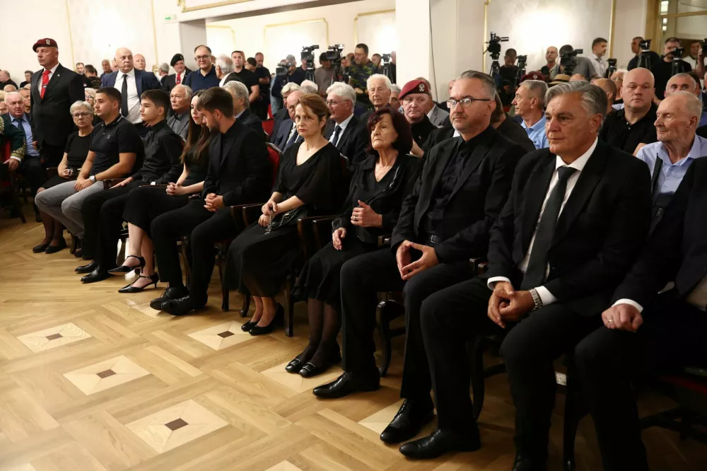 Former Bosnian Serb wartime general Ratko Mladic's wife, Bosiljka, his son, Darko, and the President of Republika Srpska, Sinisa Karan, attend a commemoration ceremony for Mladic in Belgrade, Serbia, September 5, 2026. REUTERS/Zorana Jevtic 