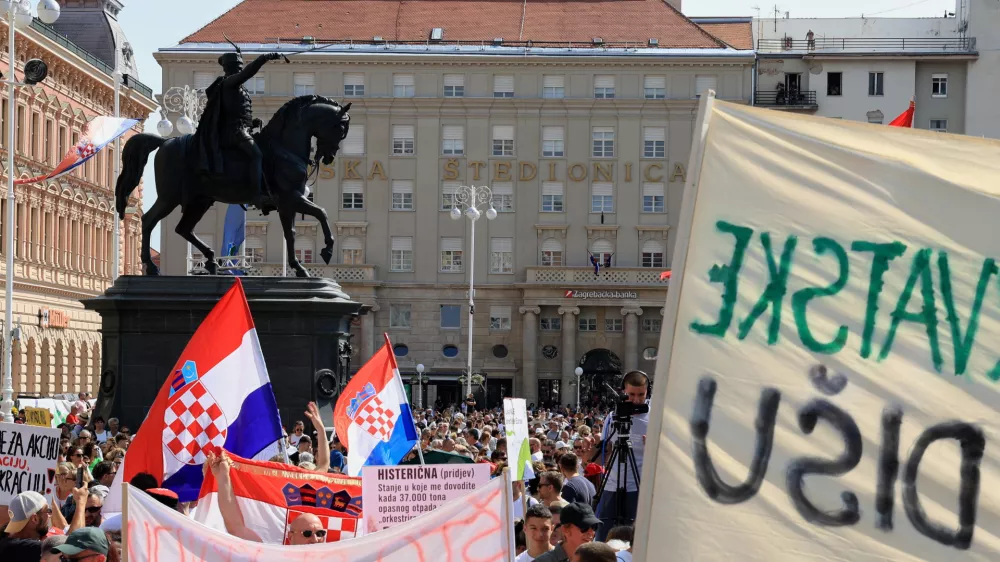 Thousands of people rally in protest over the discovery of illegally imported and disposed waste, including hazardous and toxic materials, in downtown Zagreb, Croatia, Saturday, Sept. 5, 2026. (AP Photo)
