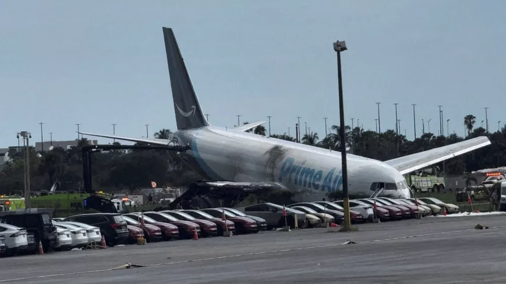 A view of the Amazon Prime Air cargo plane that airport officials said overran a runway at Miami, Florida, U.S., September 6, 2026, in this screengrab from a social media video. Rohan Ellis/via REUTERS THIS IMAGE HAS BEEN SUPPLIED BY A THIRD PARTY. MANDATORY CREDIT. NO RESALES. NO ARCHIVES. THIS PICTURE WAS PROCESSED BY REUTERS TO ENHANCE QUALITY. AN UNPROCESSED VERSION HAS BEEN PROVIDED SEPARATELY. VERIFICATION: - Date and location verified by metadata on original file - Fence, light poles and airfield layout matched archive imagery