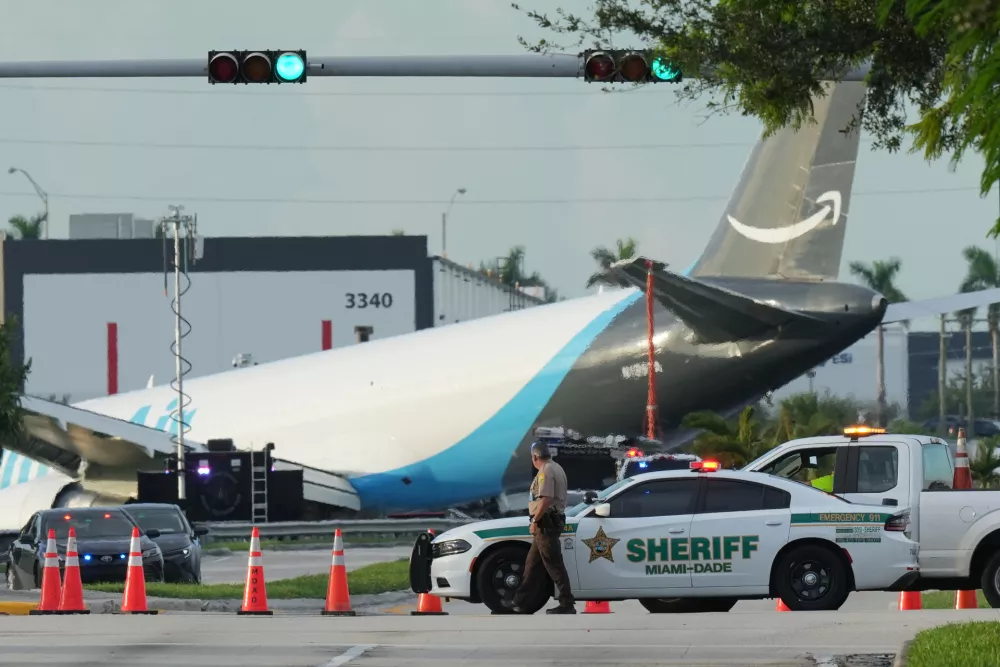 An Amazon cargo plane sits at the Miami International Airport (MIA) after it overshot the runway, Sunday, Sept. 6, 2026. (AP Photo/Lynne Sladky)