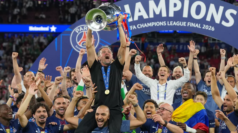 PSG's head coach Luis Enrique celebrates with the trophy after defeating Arsenal during the Champions League final soccer match between Paris Saint-Germain and Arsenal in Budapest, Hungary, Saturday, May 30, 2026. (AP Photo/Andreea Alexandru)