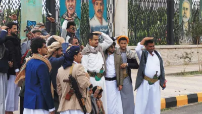 Houthi supporters pose a groom in front of posters from right showing late Hamas leader Ismail Haniyeh, and what they describe martyrs Maher Al-Jazi of Jordan, Mohammed Salah of Egypt, in Sanaa, Yemen, Sunday, Sept. 6, 2026. (AP Photo/Osamah Abdulrahman)