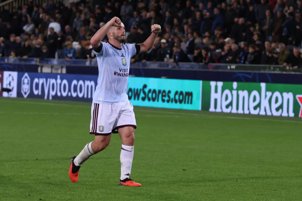 Aston Villa's John McGinn celebrates at the end of the Champions League opening phase soccer match between Club Brugge and Aston Villa in Bruges, Belgium, Tuesday, Sept. 8, 2026. (AP Photo/Omar Havana)